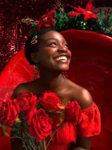 black woman with roses and red dress